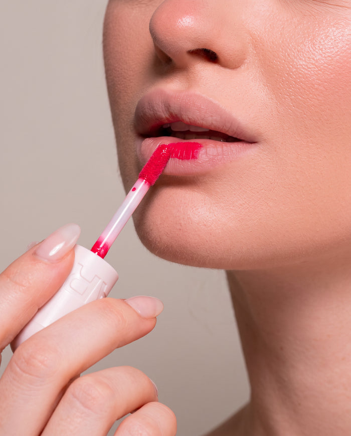 Start small — a stroke along the centre of your lower lip, then press your lips together.